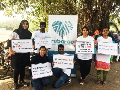 Youth holding posters